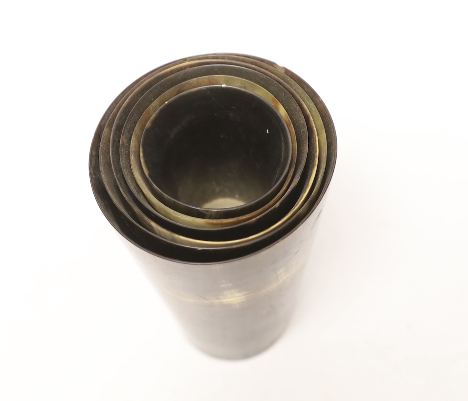 A graduated set of six Victorian horn beakers, largest 12.5cm